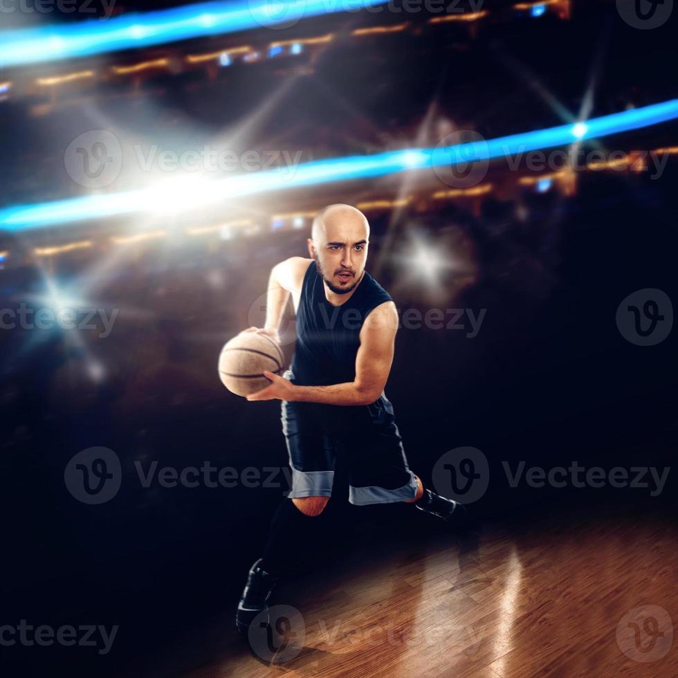 Basketballer in action with a ball photo