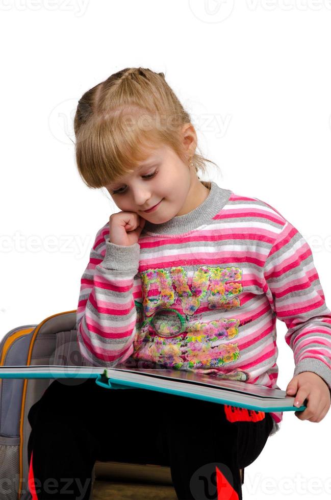 closeup of young girl read a book photo