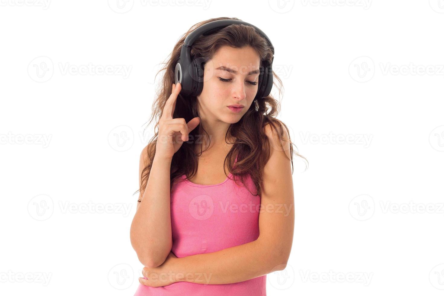girl in headphones in studio photo