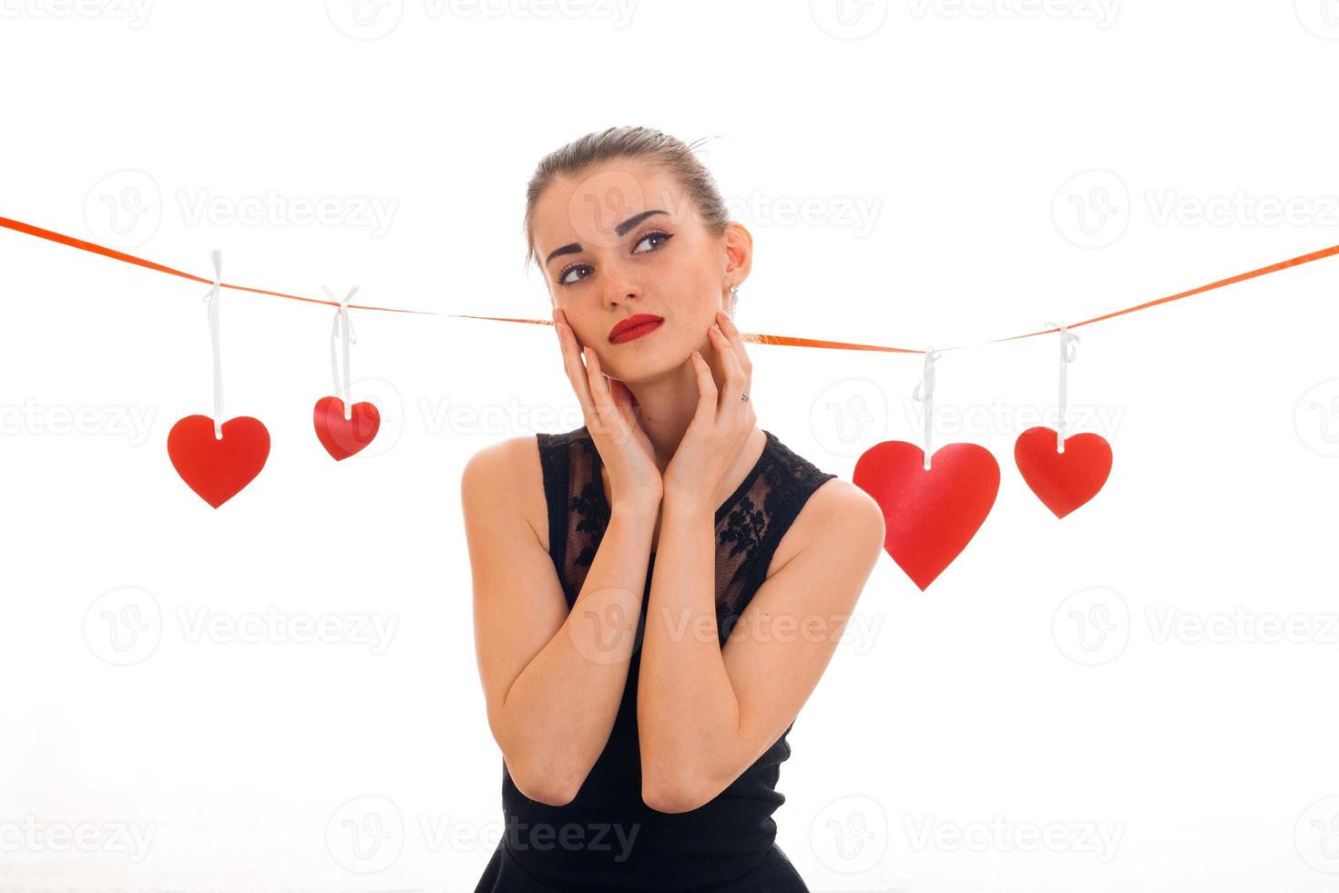 Valentine's day concept. Love . Young girl with red heart isolated on white background in studio photo