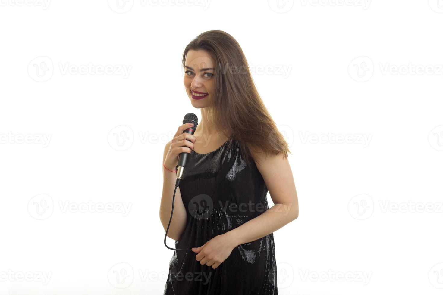 pretty young woman sings a karaoke photo