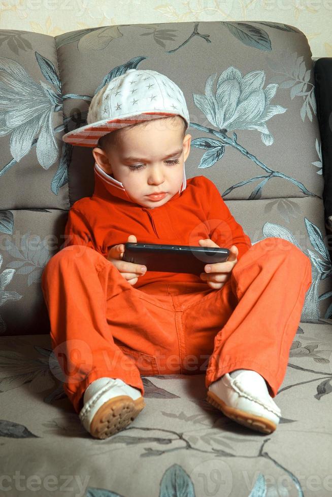 young boy in red suit photo