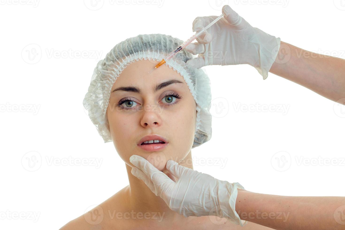Portrait of a young girl without makeup in the CAP which make the white gloves prick on her face photo