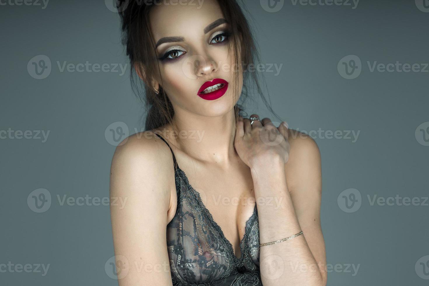 sensual portrait of young girl with red lips in beautiful lace bra photo