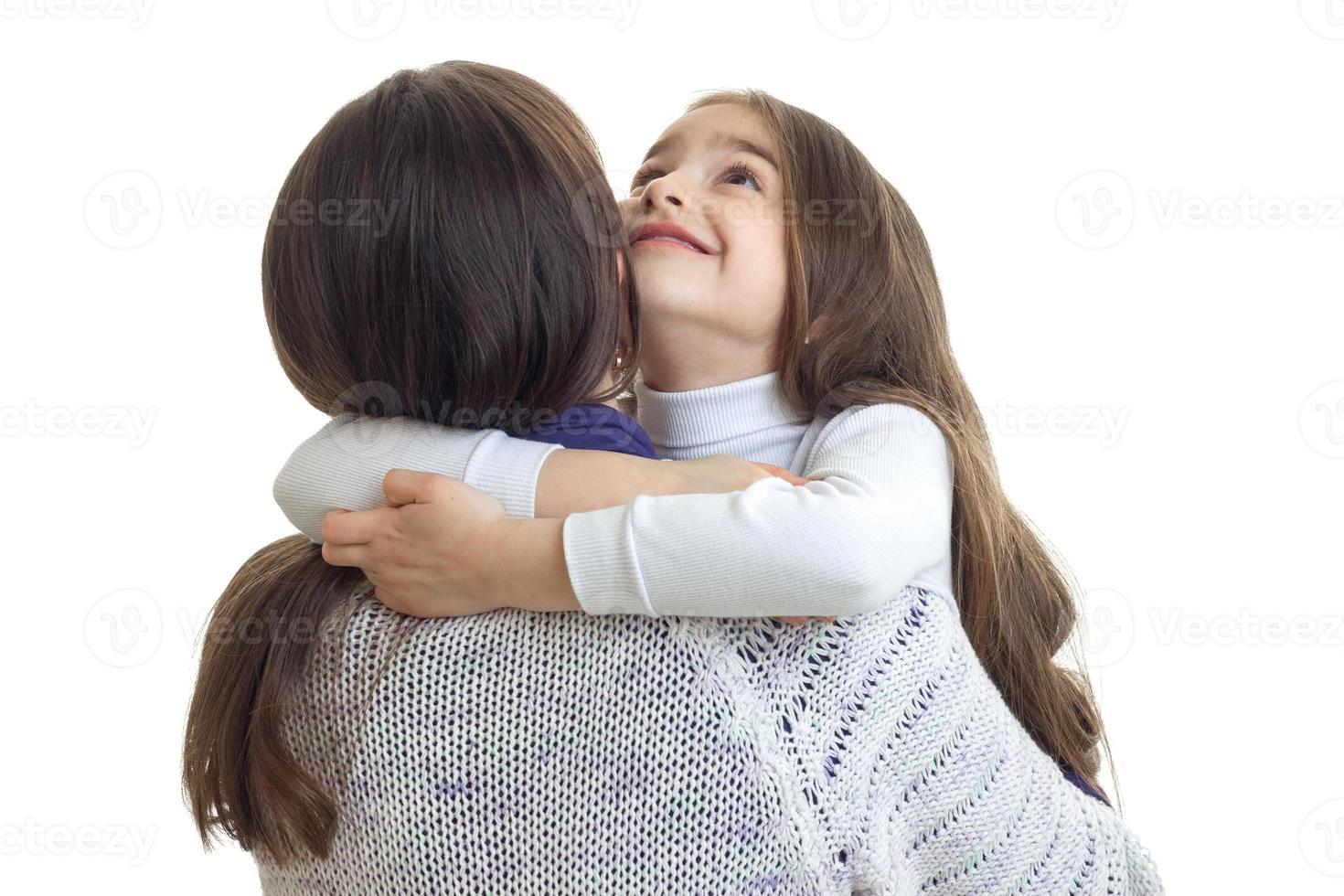 mother hugging with her daughter photo