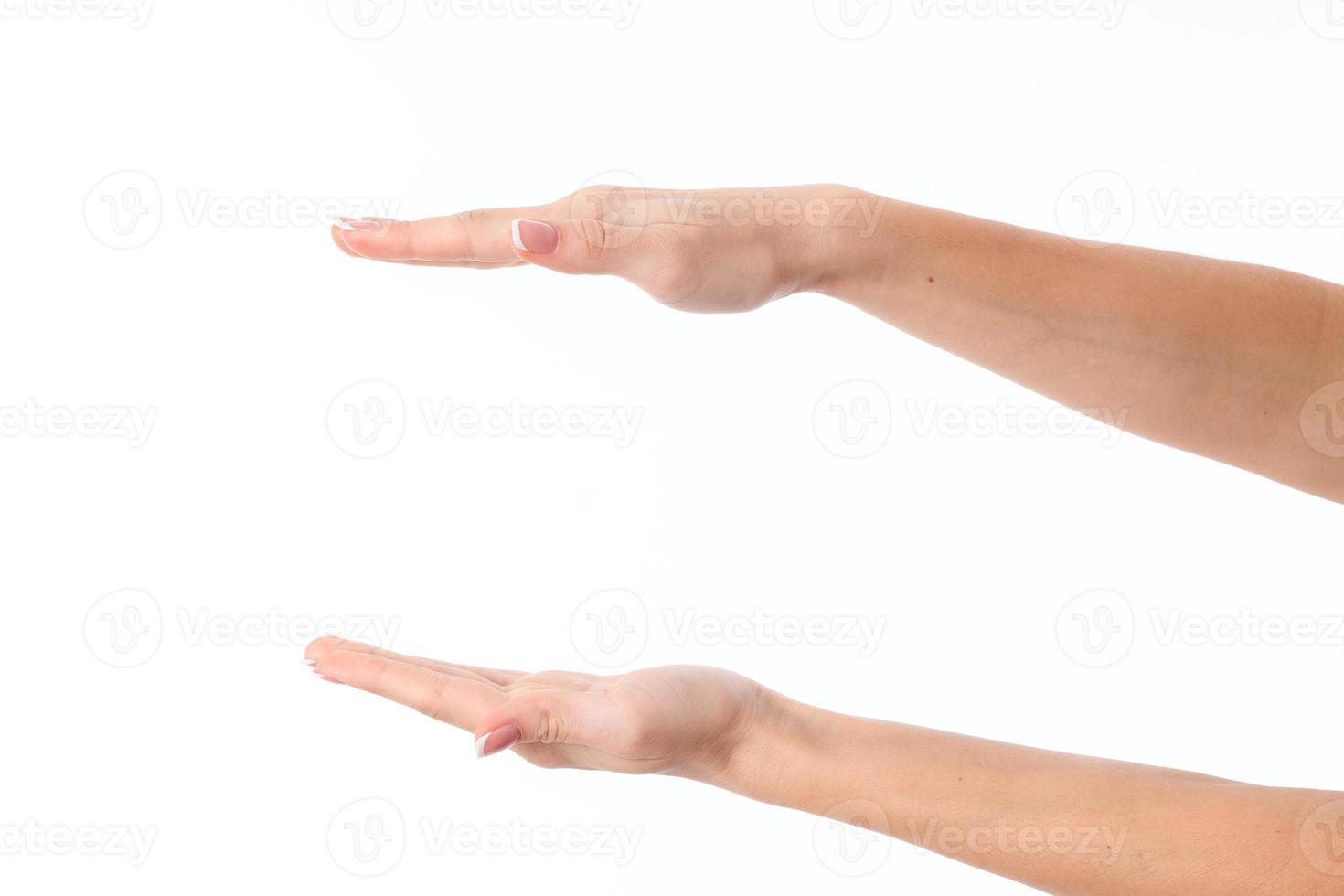 two female hands outstretched toward the one opposite the other isolated on white background photo