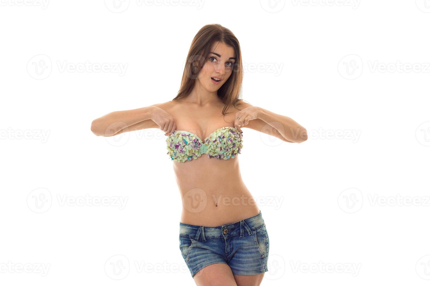 lovely slim brunette woman in swisuit posing isolated on white background photo