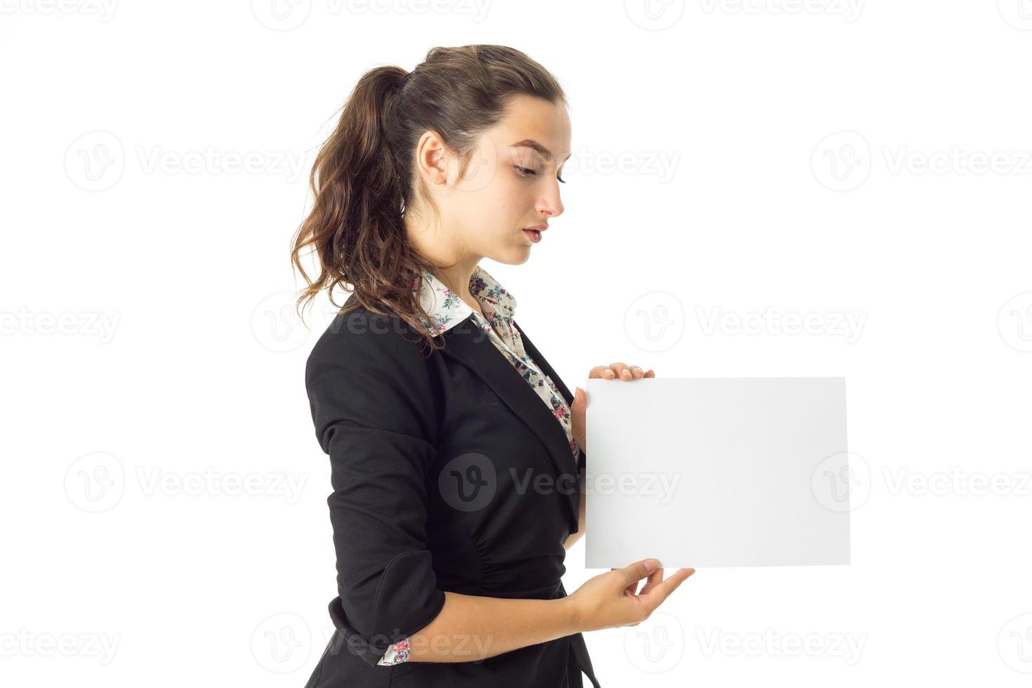 woman in uniform with white placard in hands photo