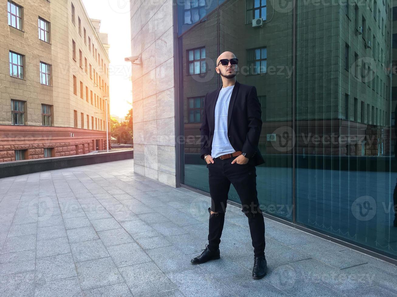 glamour young business man in black sunglasses photo