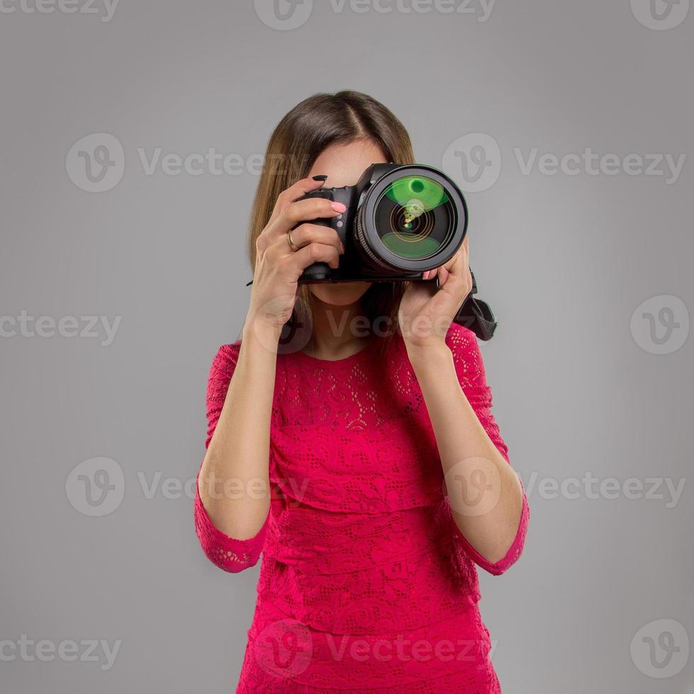 woman making a photo on a professional camera