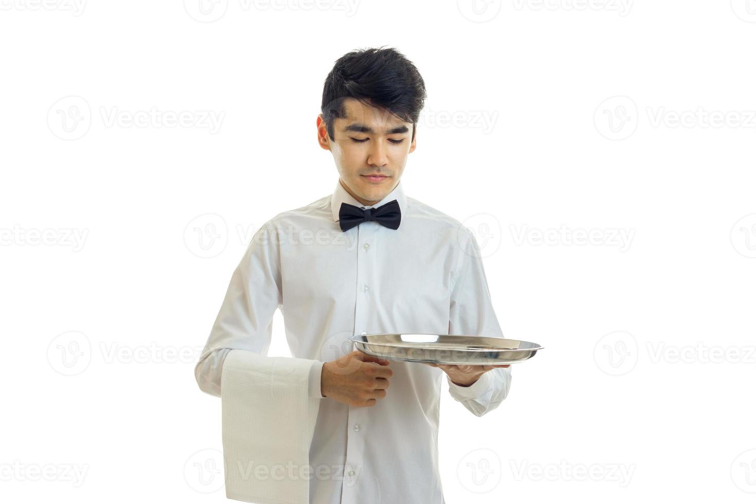 handsome brunette man waiter with trey in hands photo