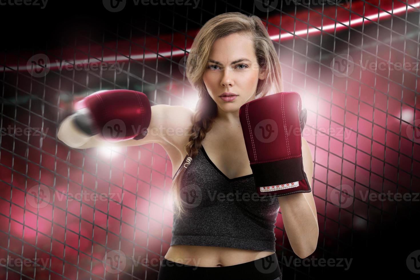 young blonde girl mma fighter in red gloves photo