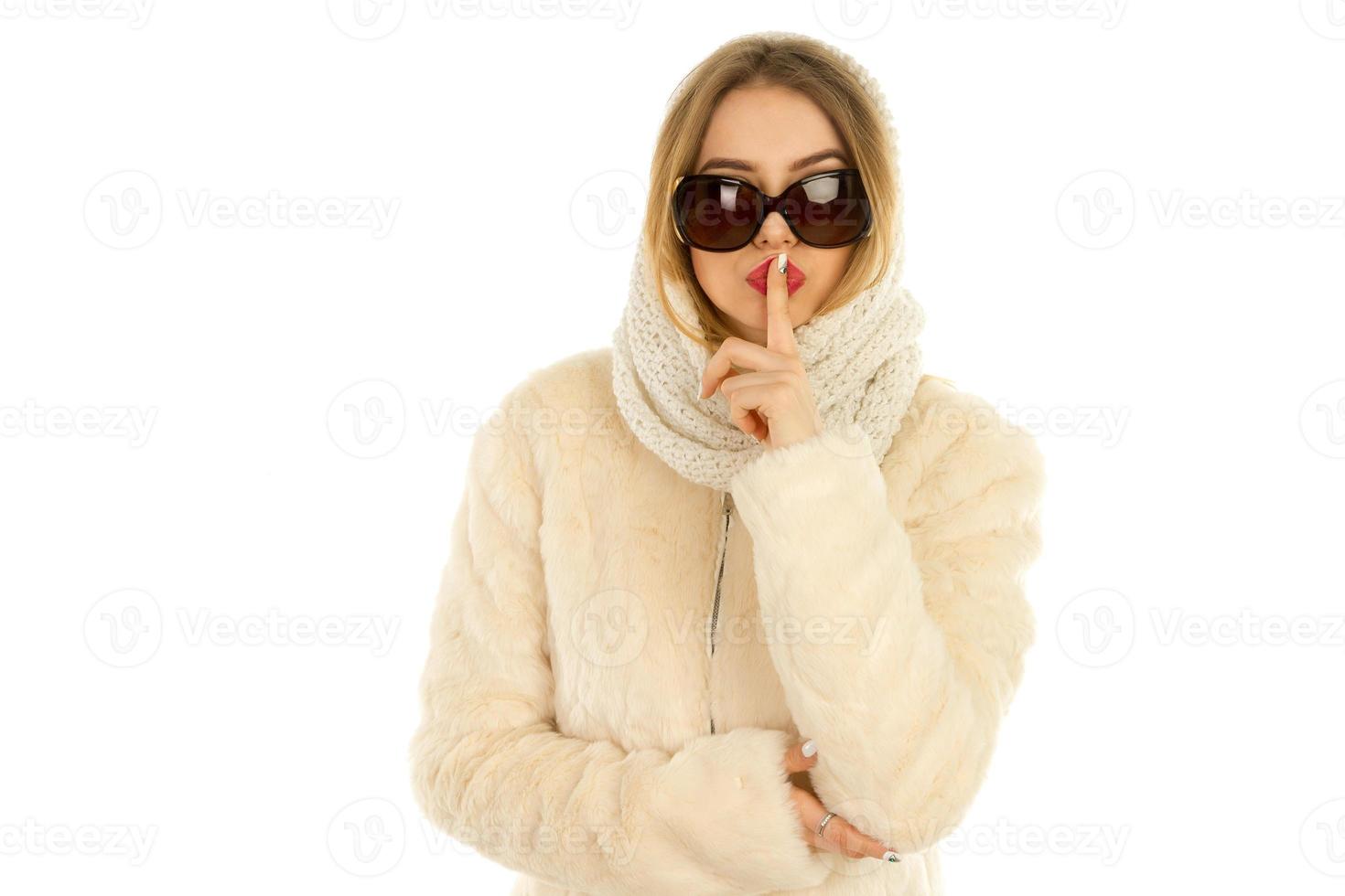 woman posing in a fur coat and scarf photo