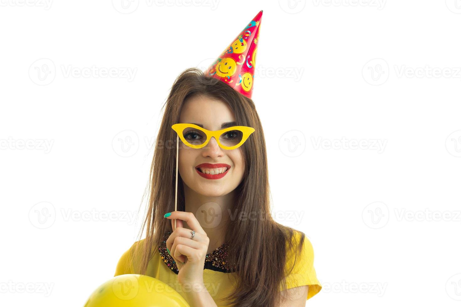 Cheerful girl with paper glasses laughing photo