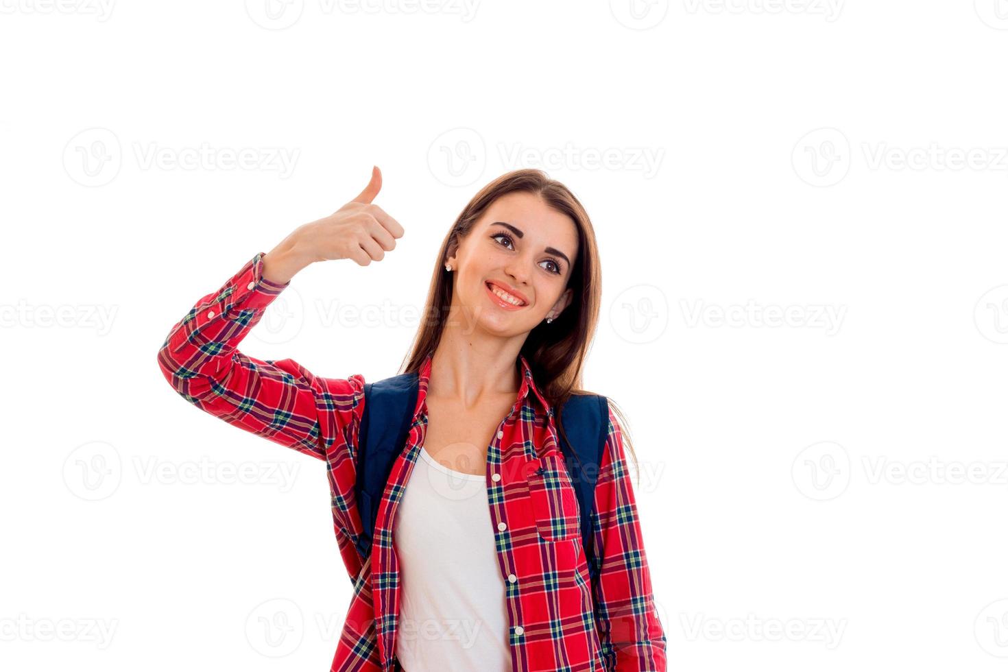 pretty young brunette students teenager in stylish clothes and backpack on her shoulders posing isolated on white background photo