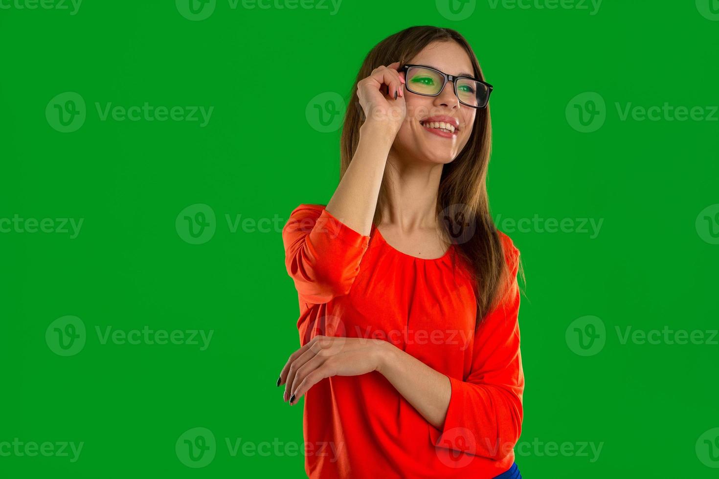 Woman in glasses posing in studio photo