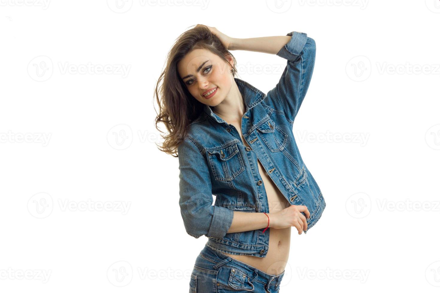 Cheerful young woman in casual jeans clothes smiling on camera photo