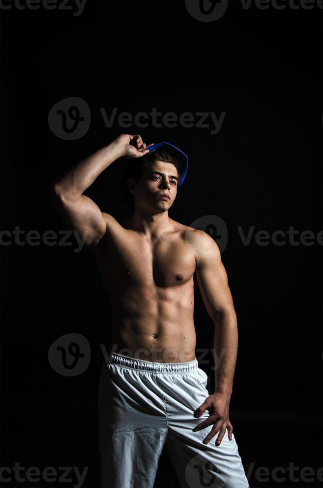 muscle body sportsman in studio photo