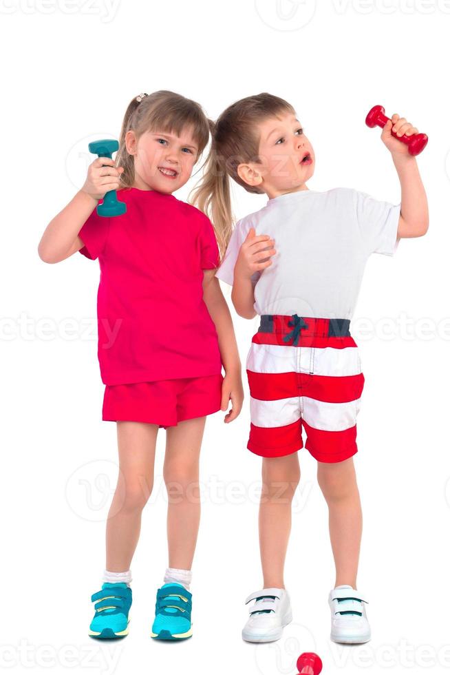 Young children with dumbbells photo