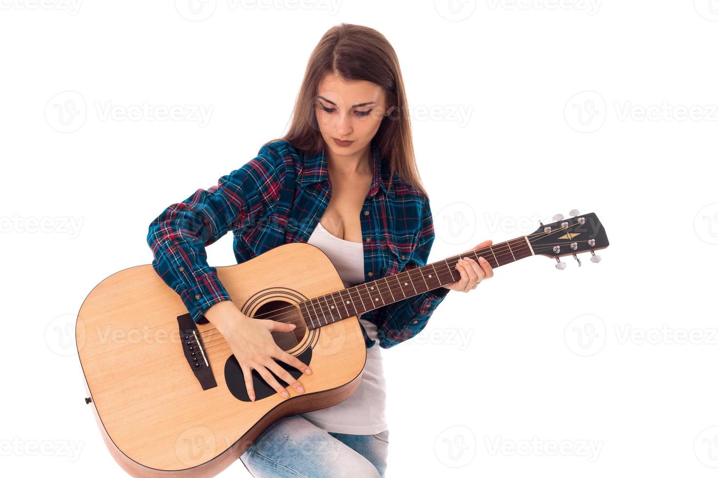 young pretty brunette woman with guitar photo