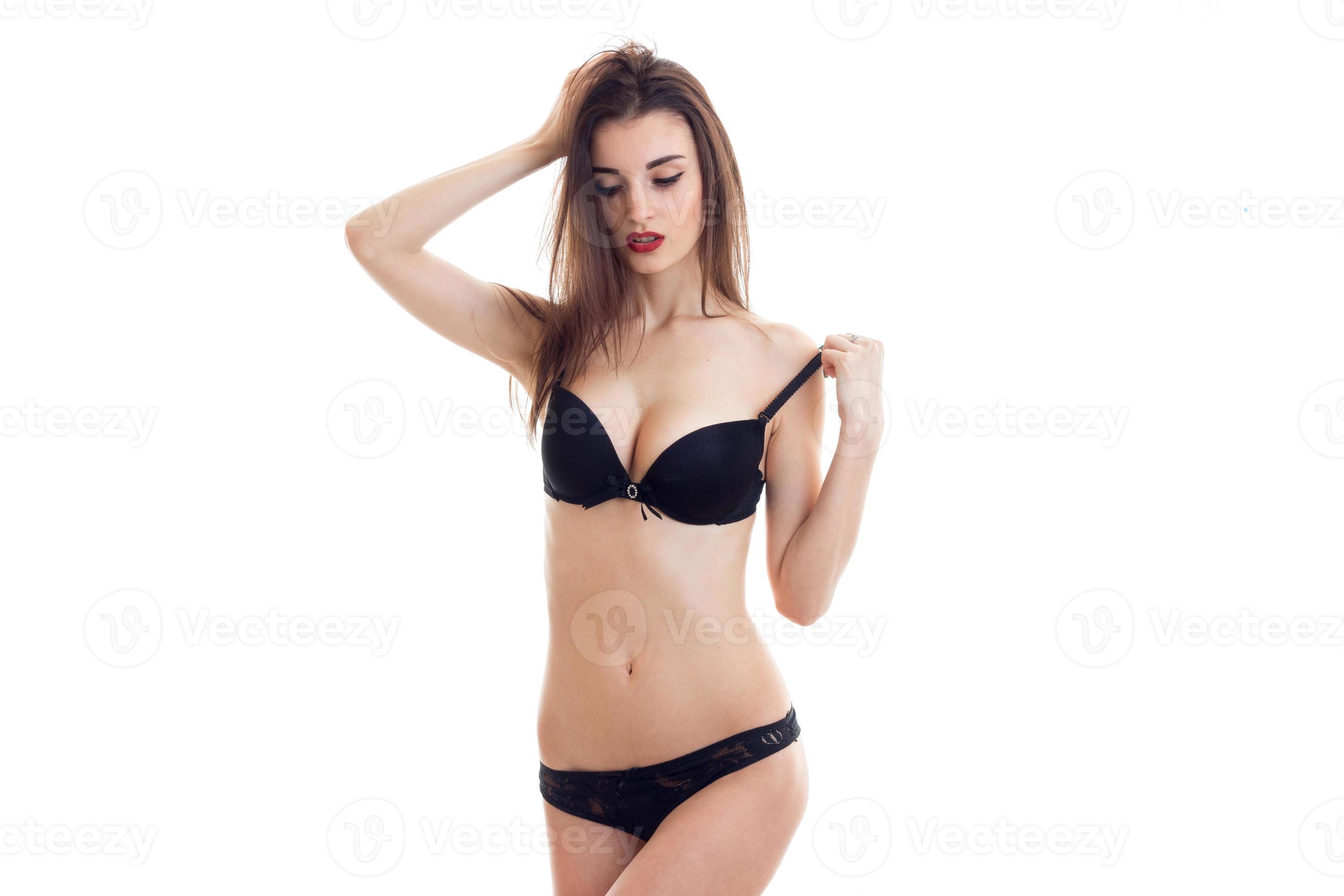 hot brunette woman in lingerie take off a bra 16492361 Stock Photo