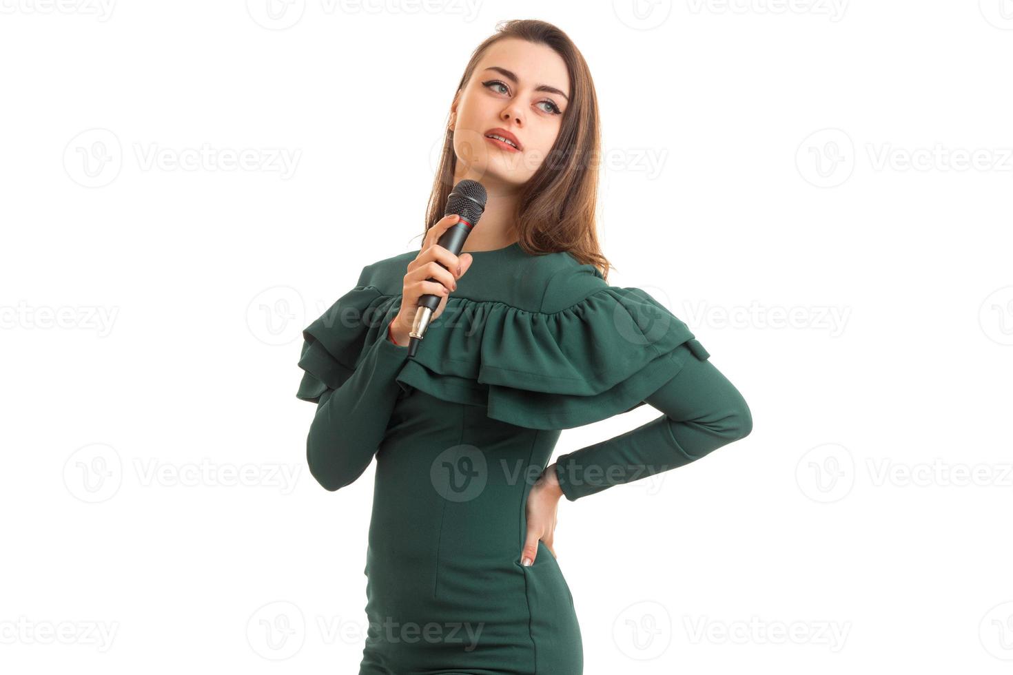 horizontal portrait of charming singer with microphone photo