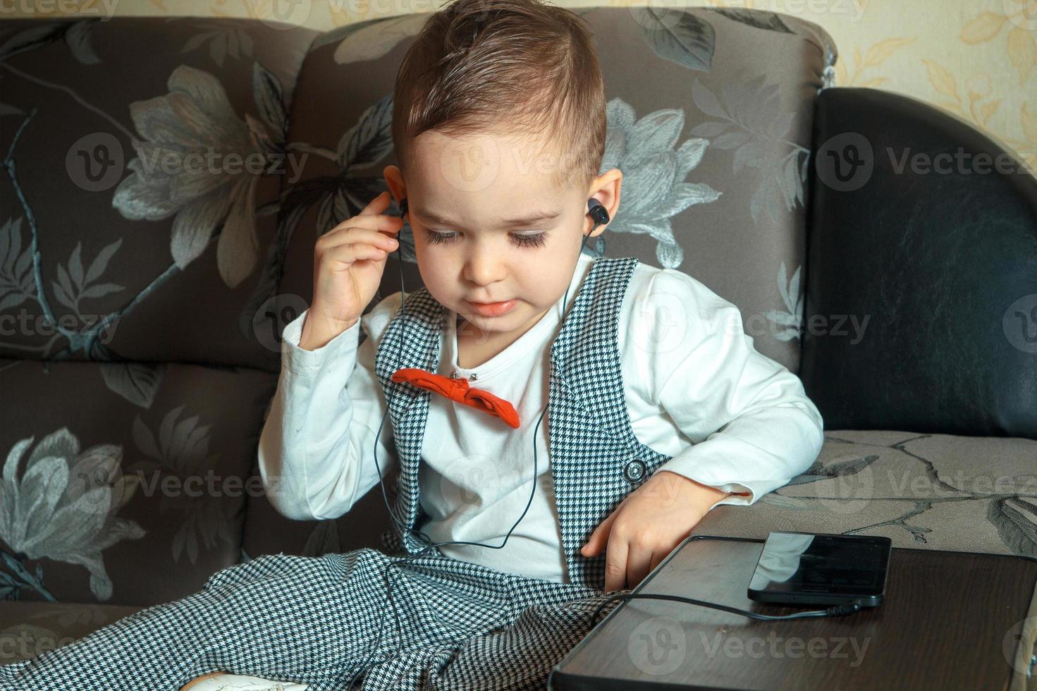 little boy listening to the music photo