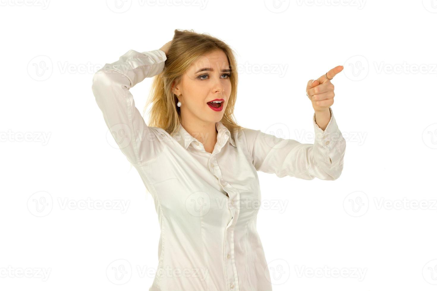girl looking to the side and finger points to something photo