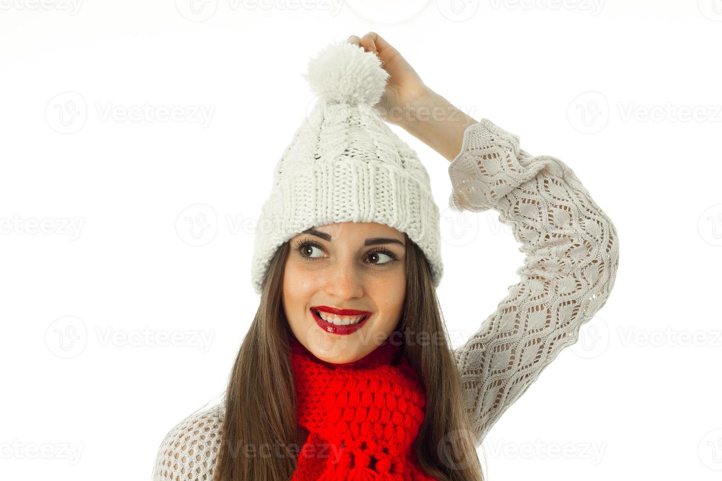 brunette girl in warm sweater and red scarf photo