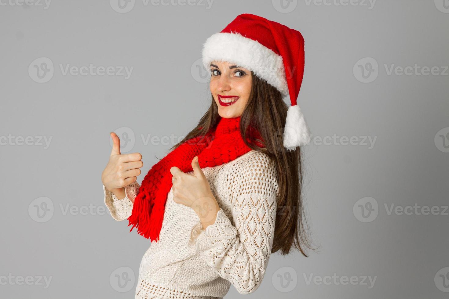 girl in santa hat and red scarf photo