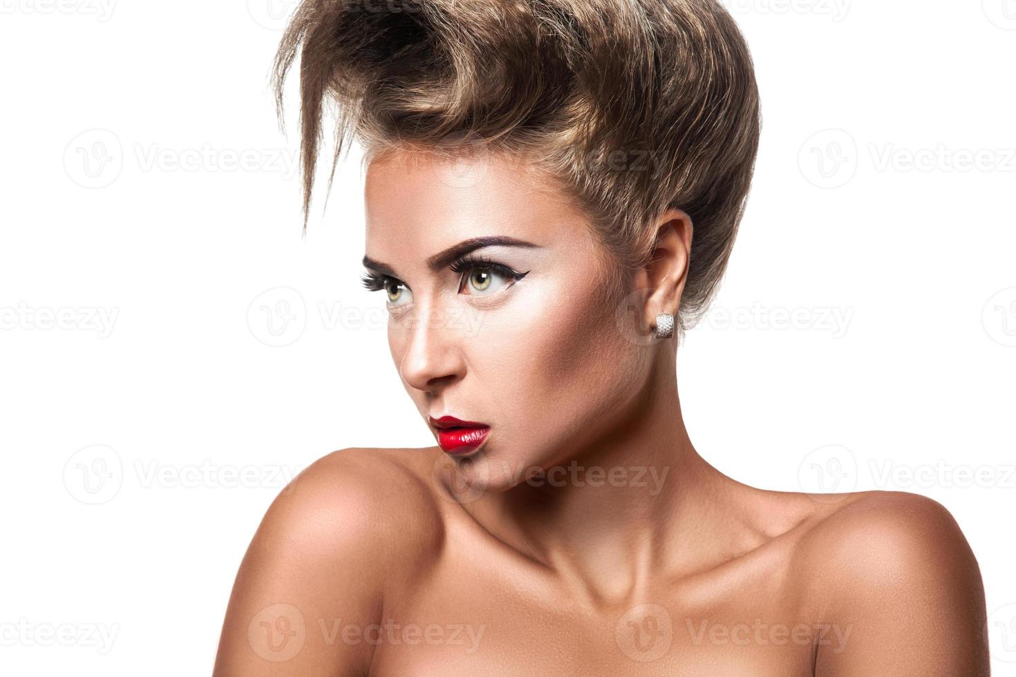 Unusually hairstyle on sexy female in studio photo