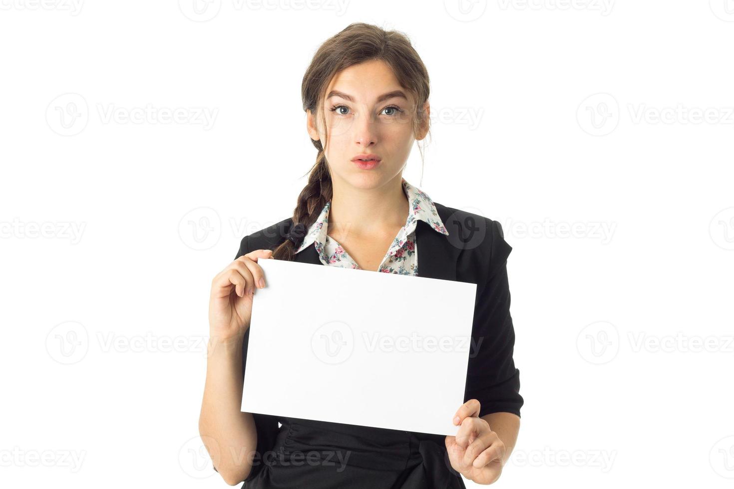 woman in uniform with white placard in hands photo
