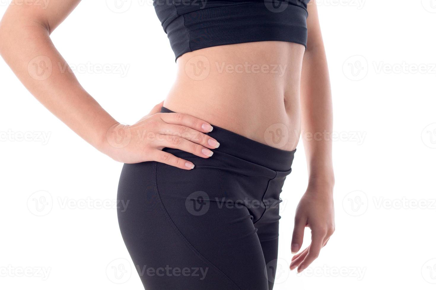 Beautiful sport belly of a young girl photo