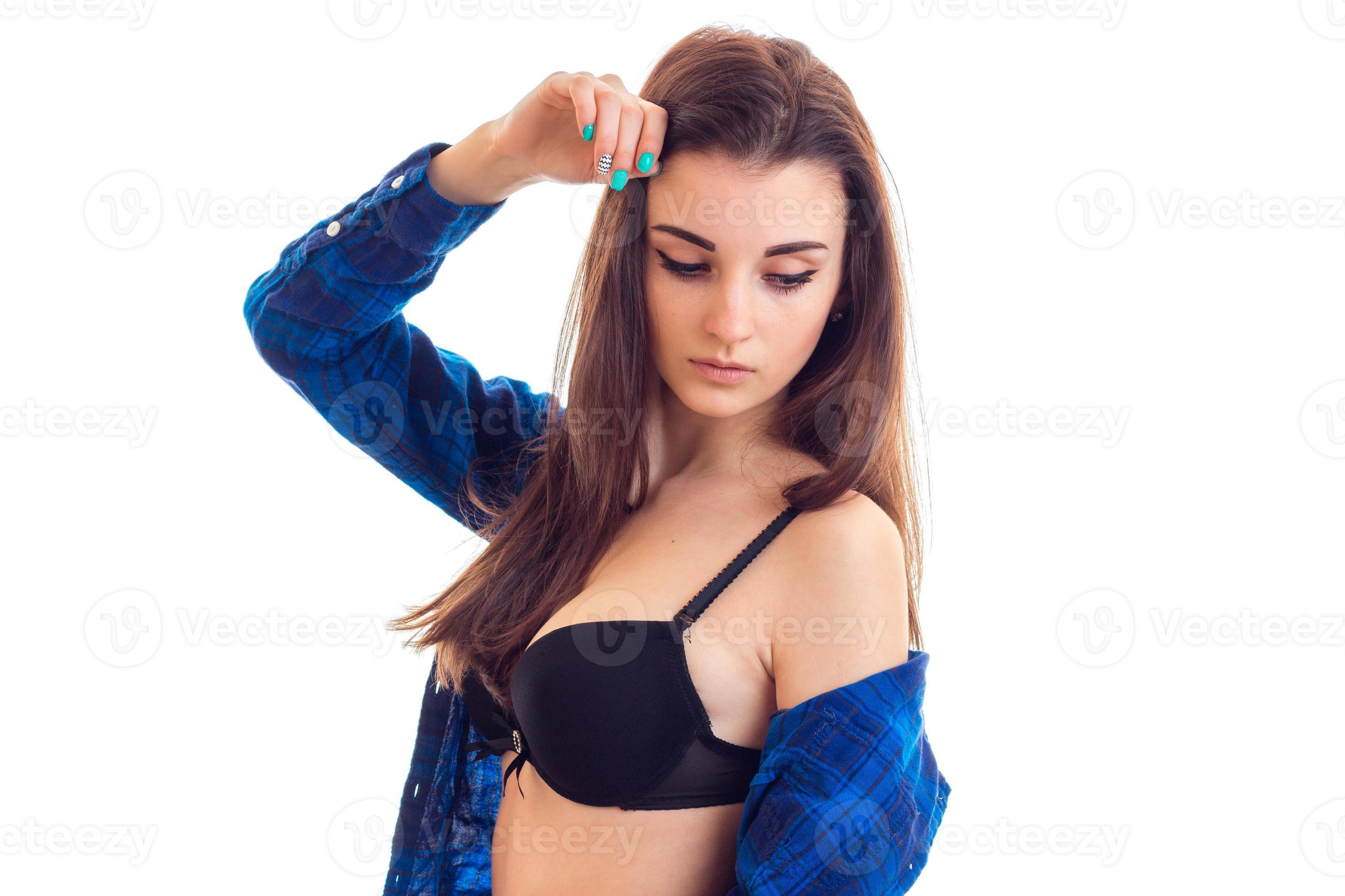 a young attractive girl in black bra and shirt looks down isolated on a  white background 16494704 Stock Photo at Vecteezy