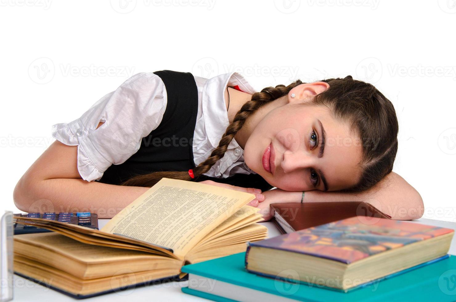 littly schoolgirl studying in studio photo