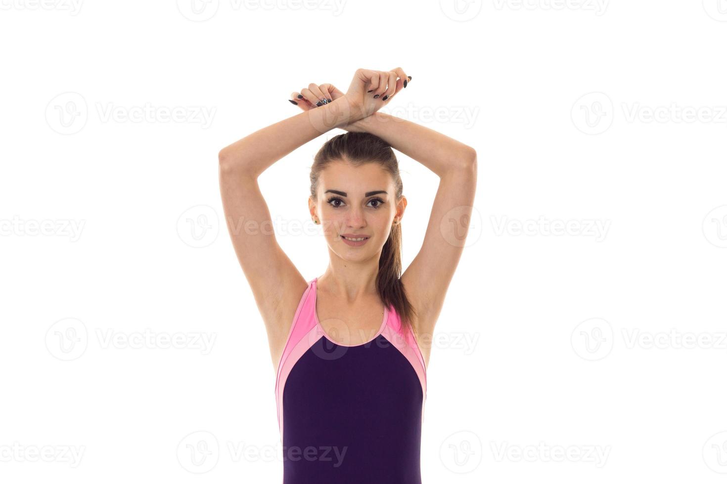a young girl stands in the body by lifting up hands isolated on white background photo