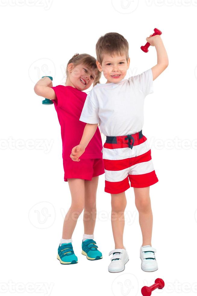 Young children with dumbbells photo