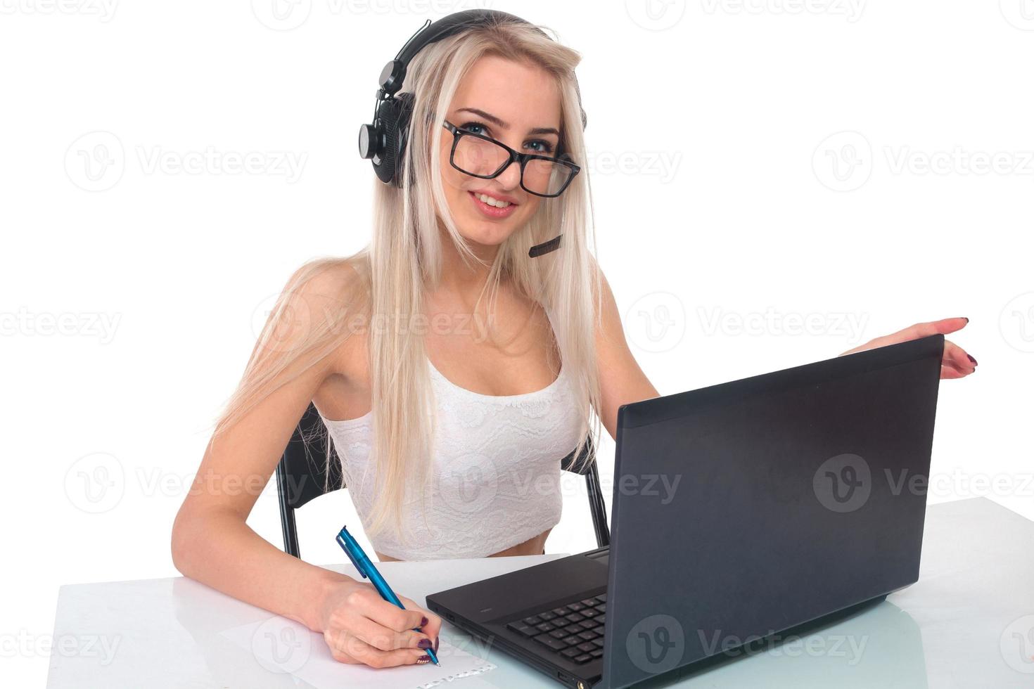 The girl in headphones with laptop photo