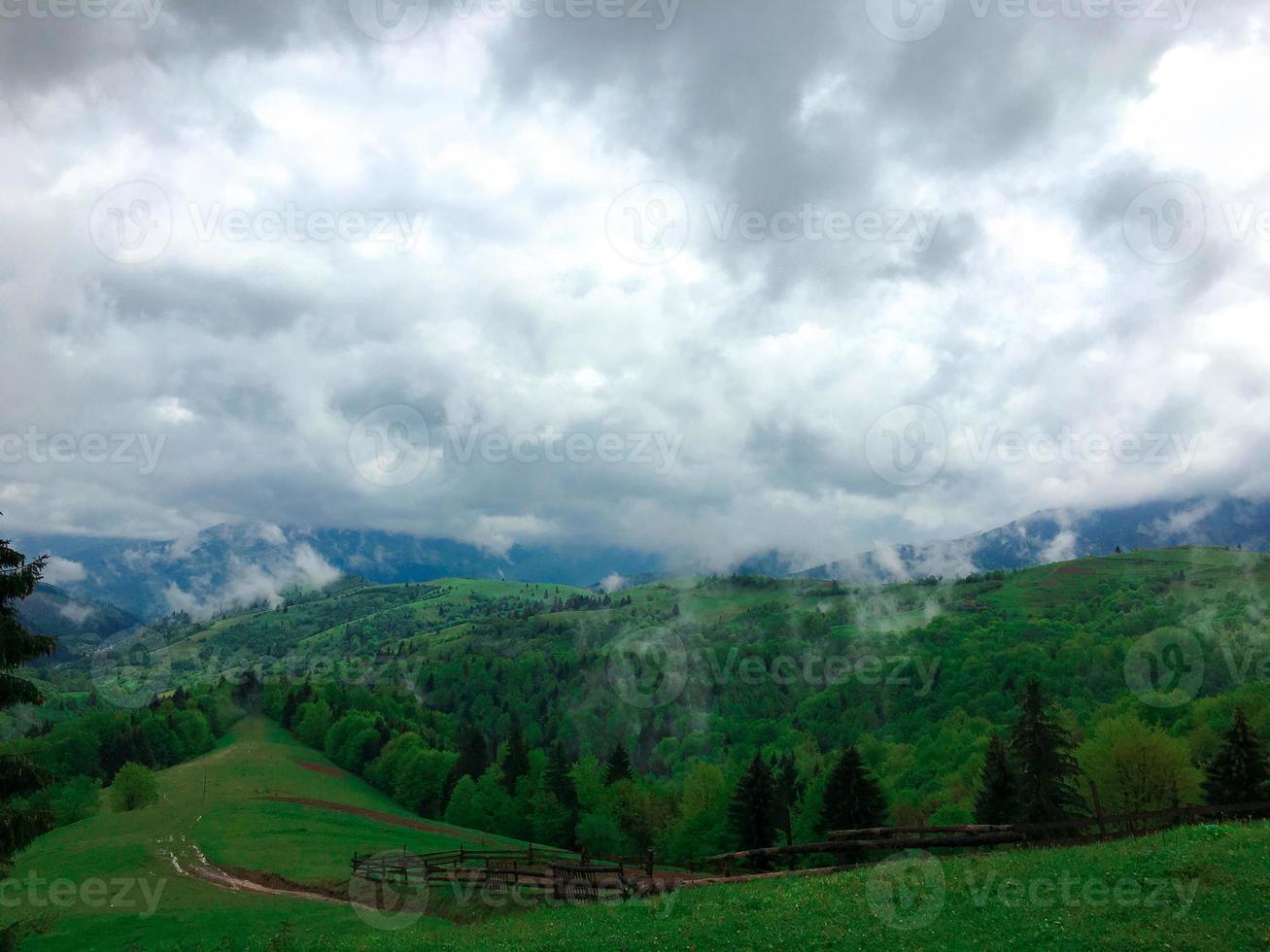 clouds rise up straight from the mountains photo