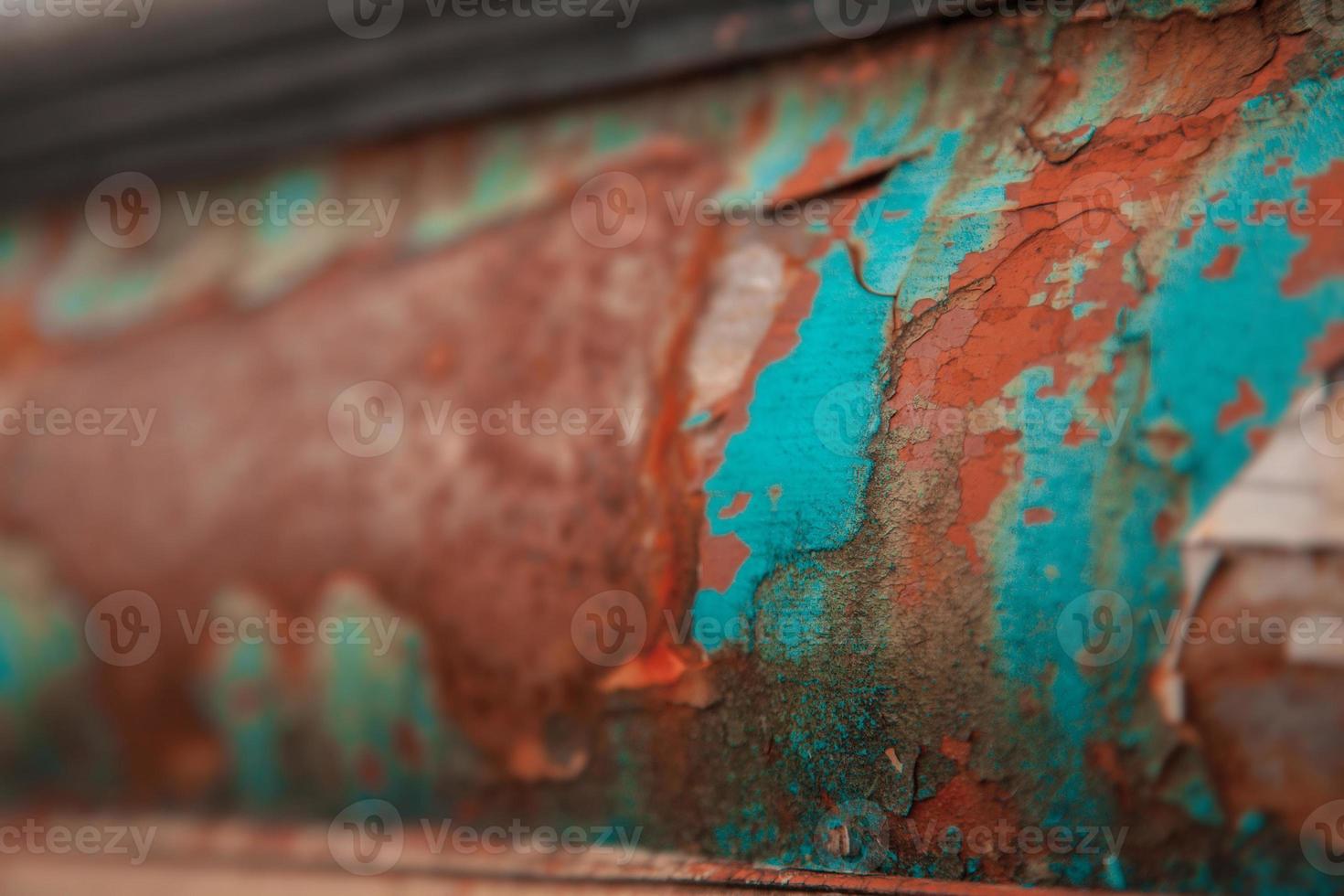 peeling paint on rusty metal photo