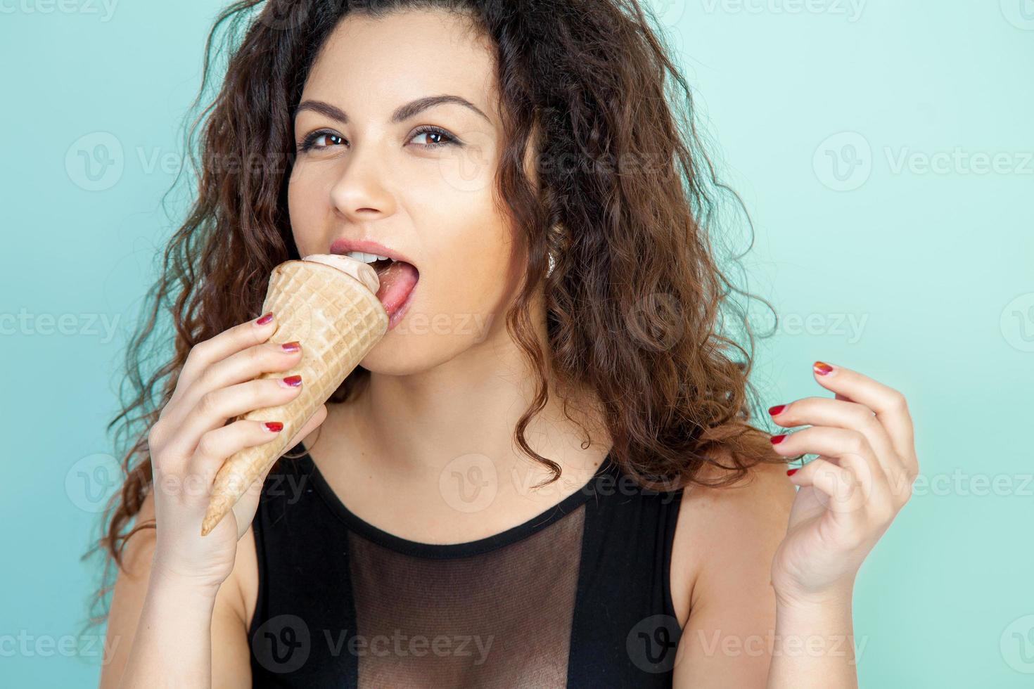 pretty woman eats ice cream photo