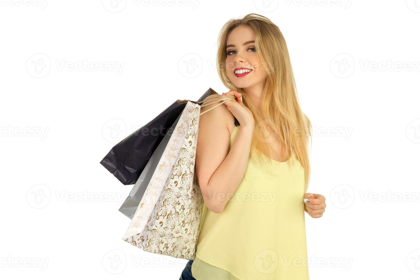 Beautiful girl posing with shopping bags photo