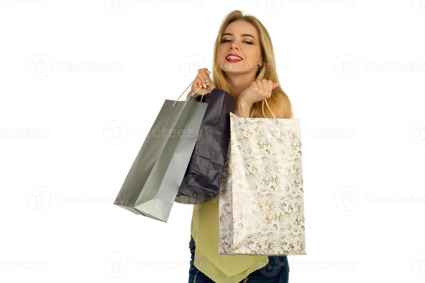 Beautiful girl posing with shopping bags photo