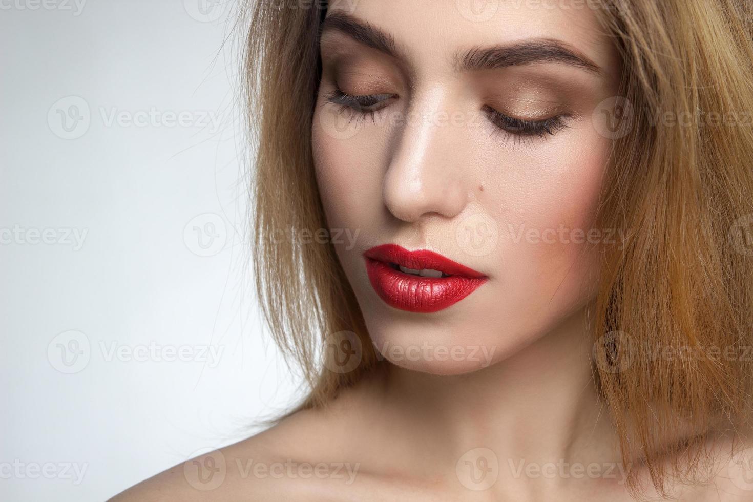 girl with red eyes in studio photo