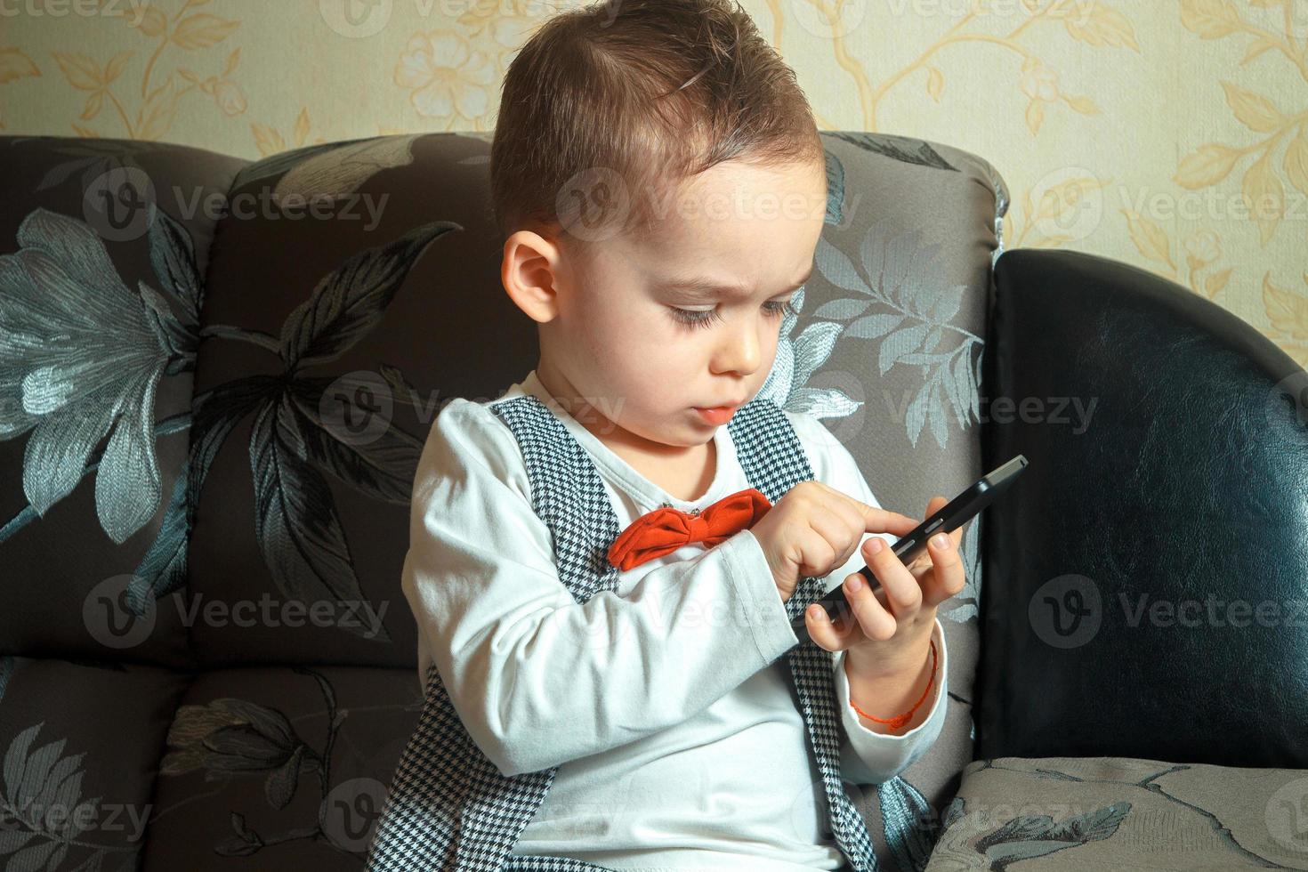 little boy with mobile phone photo