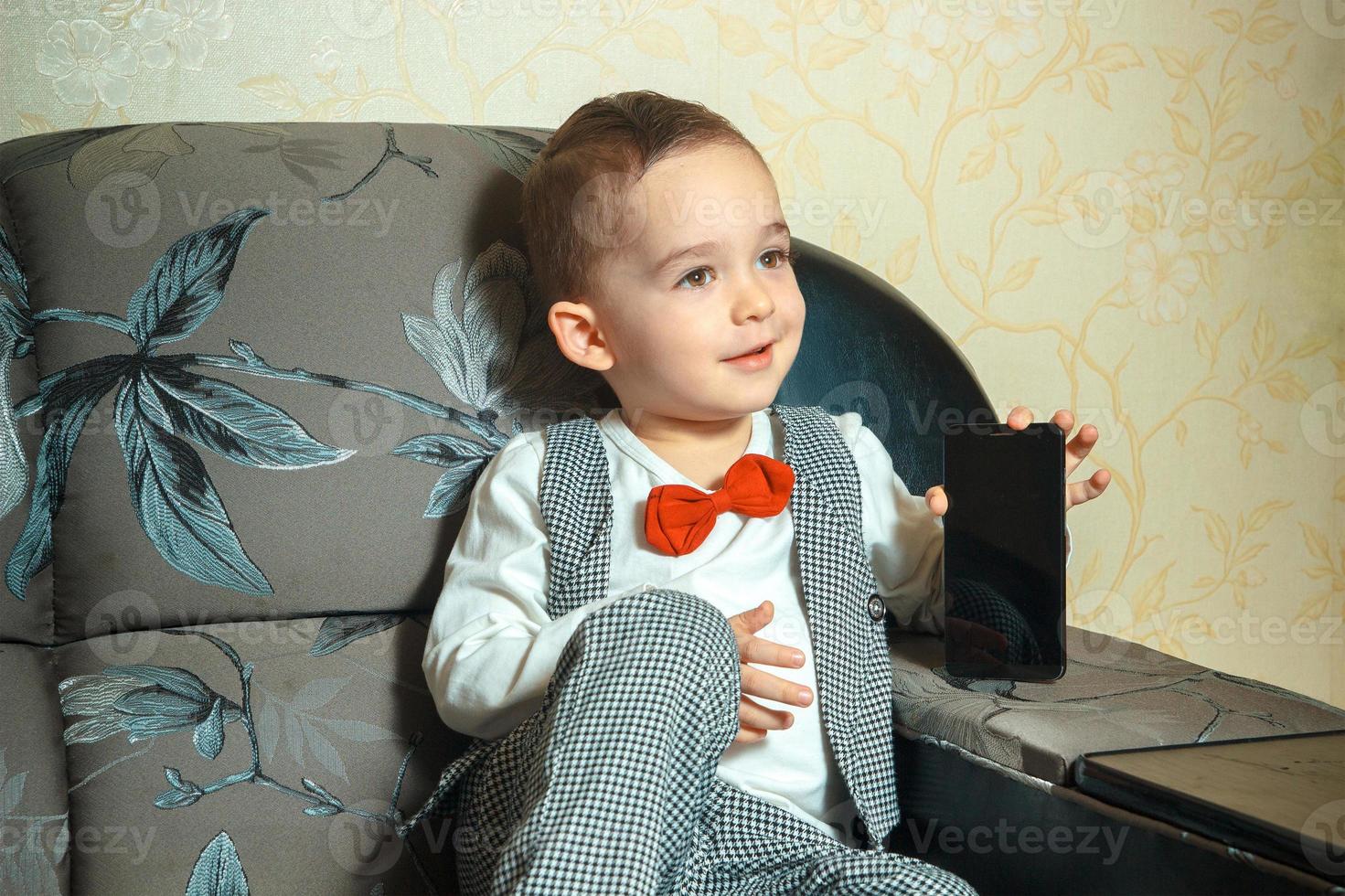 young boy with mobile photo