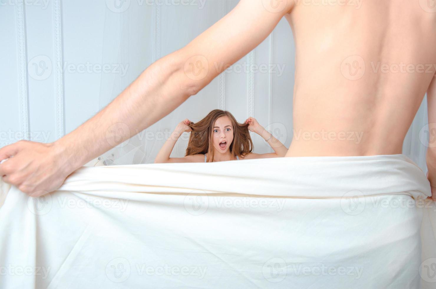 man showing his nude body to her girlfriend photo