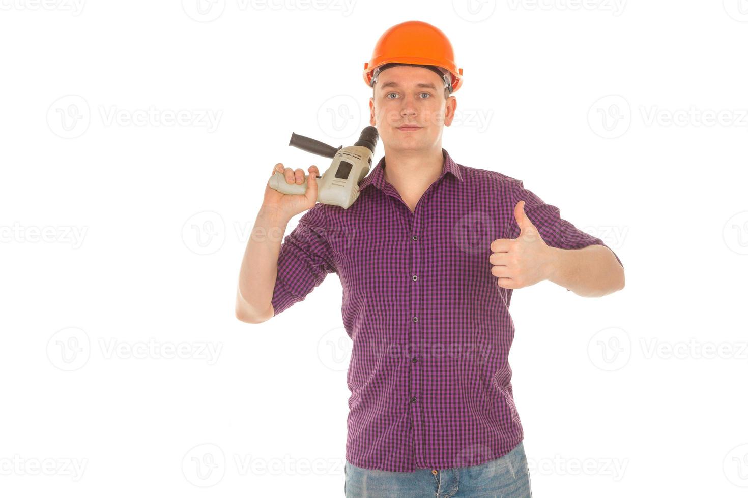 man builder with drill in his hand photo