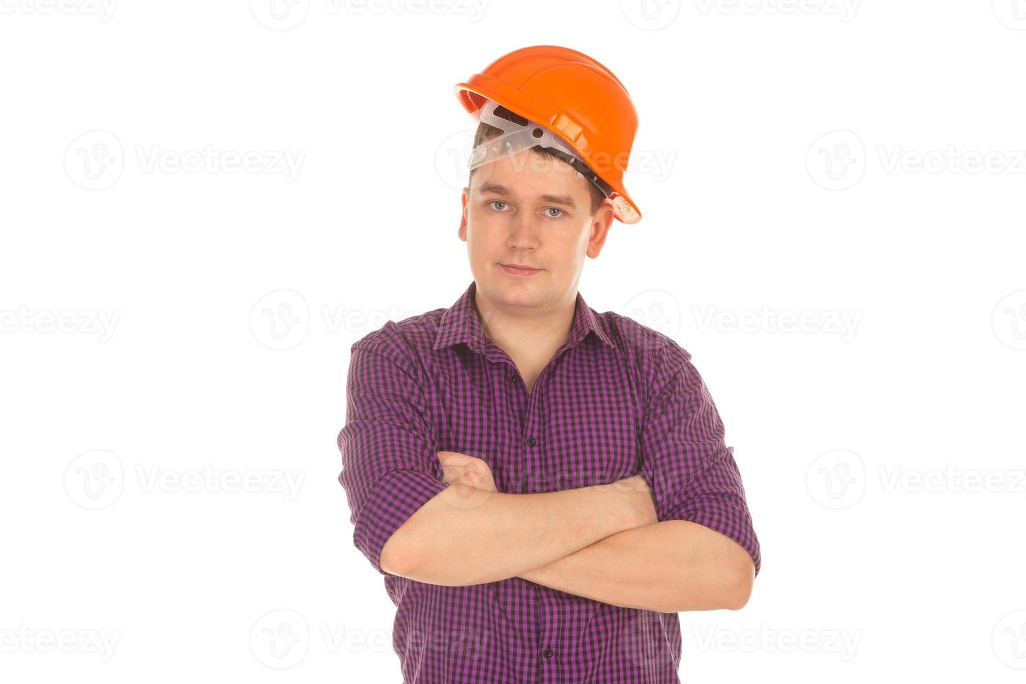 man builder in helmet looking at the camera photo