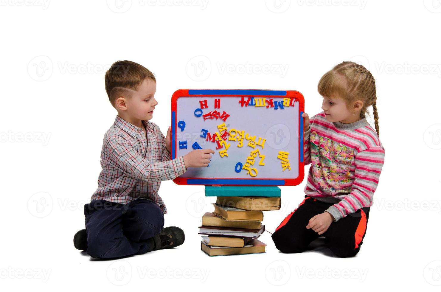 boy and girl learn alphabet photo